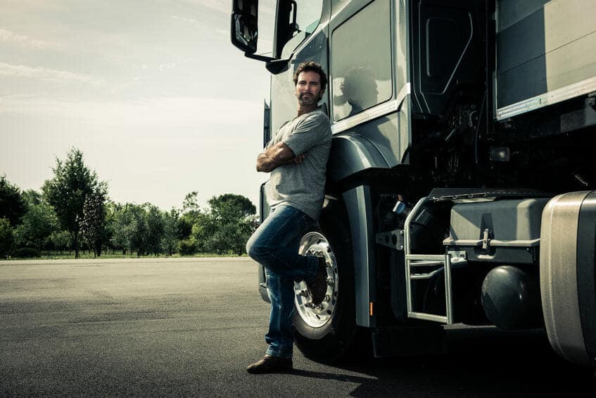 Truck driver leaning on his truck Truck Driver Leaning on his Truck