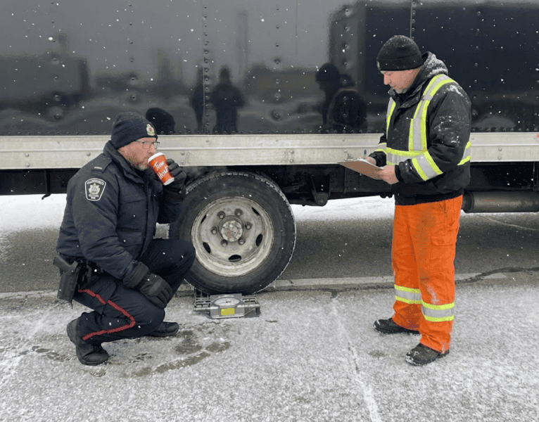 MTO officers inspecting a truck in Ontario.